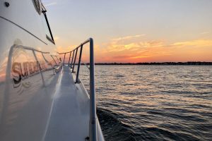 sunset view from bow of brennan boat